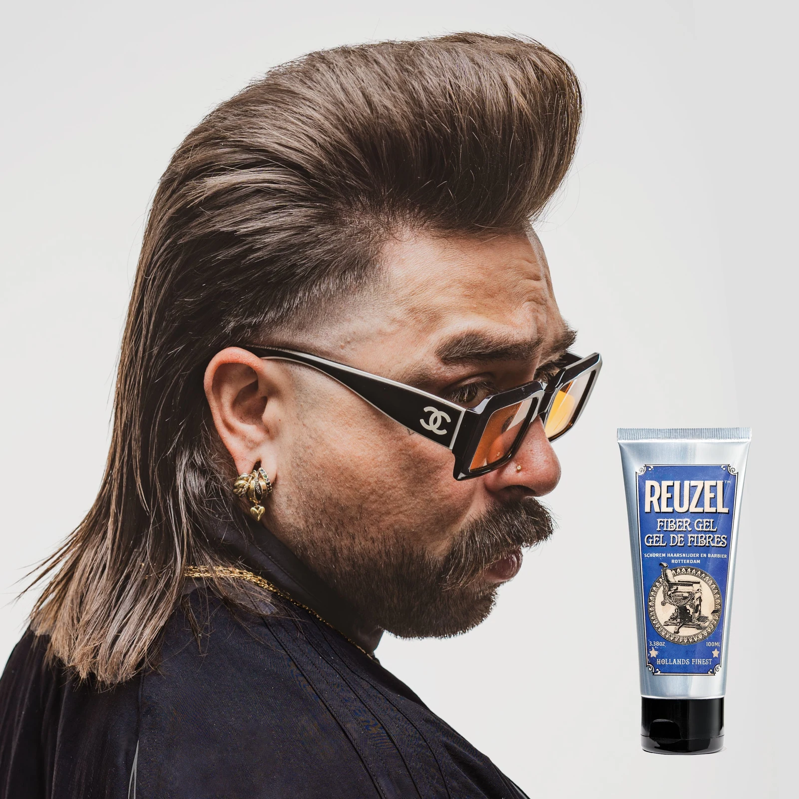 Reuzelinc fiber hair gel in a jar, styled with a thick, textured look showing its strong hold for hair styling., view 7