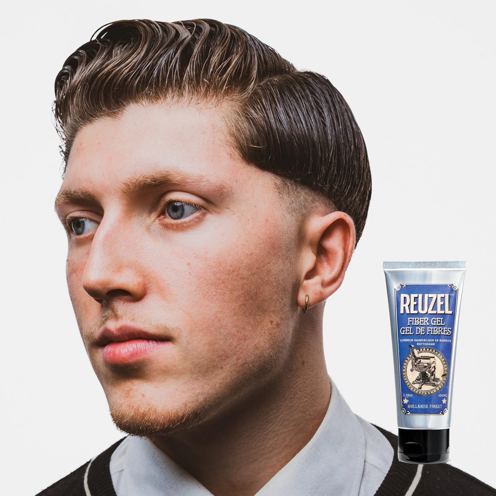 Reuzelinc fiber hair gel in a tub, showing thick, textured hair styled with the gel for a strong hold and matte finish.