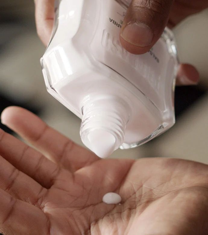 Proraso - After Shave Balm - Sensitive - 25ml: Proraso Sensitive After Shave Balm being poured into the palm of hand., view 5
