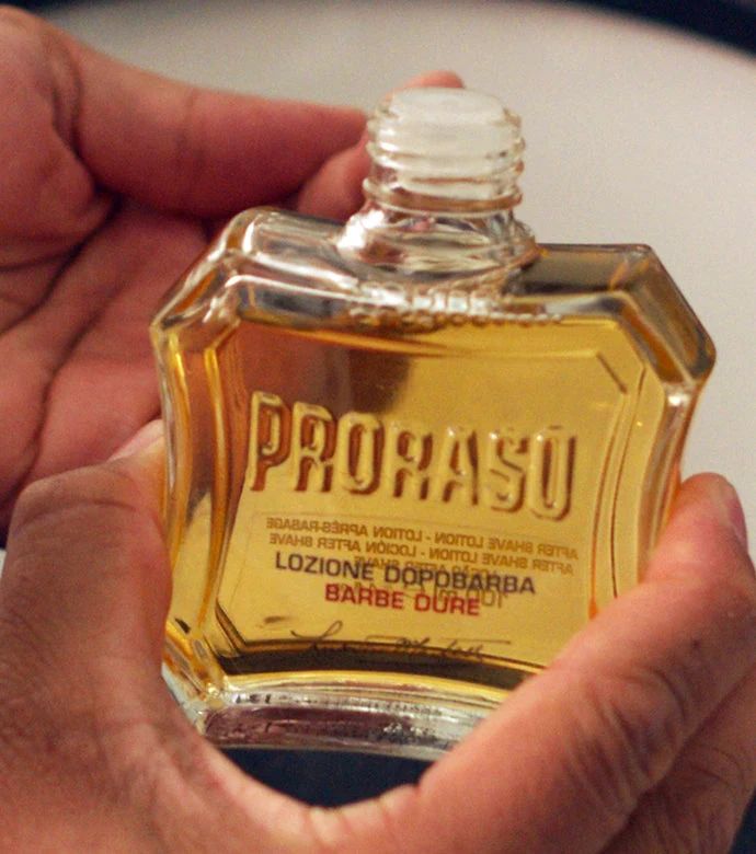 Proraso - After Shave Lotion - Sandalwood - 400ml: Coarse Beards After Shave Lotion being held in hand., view 8