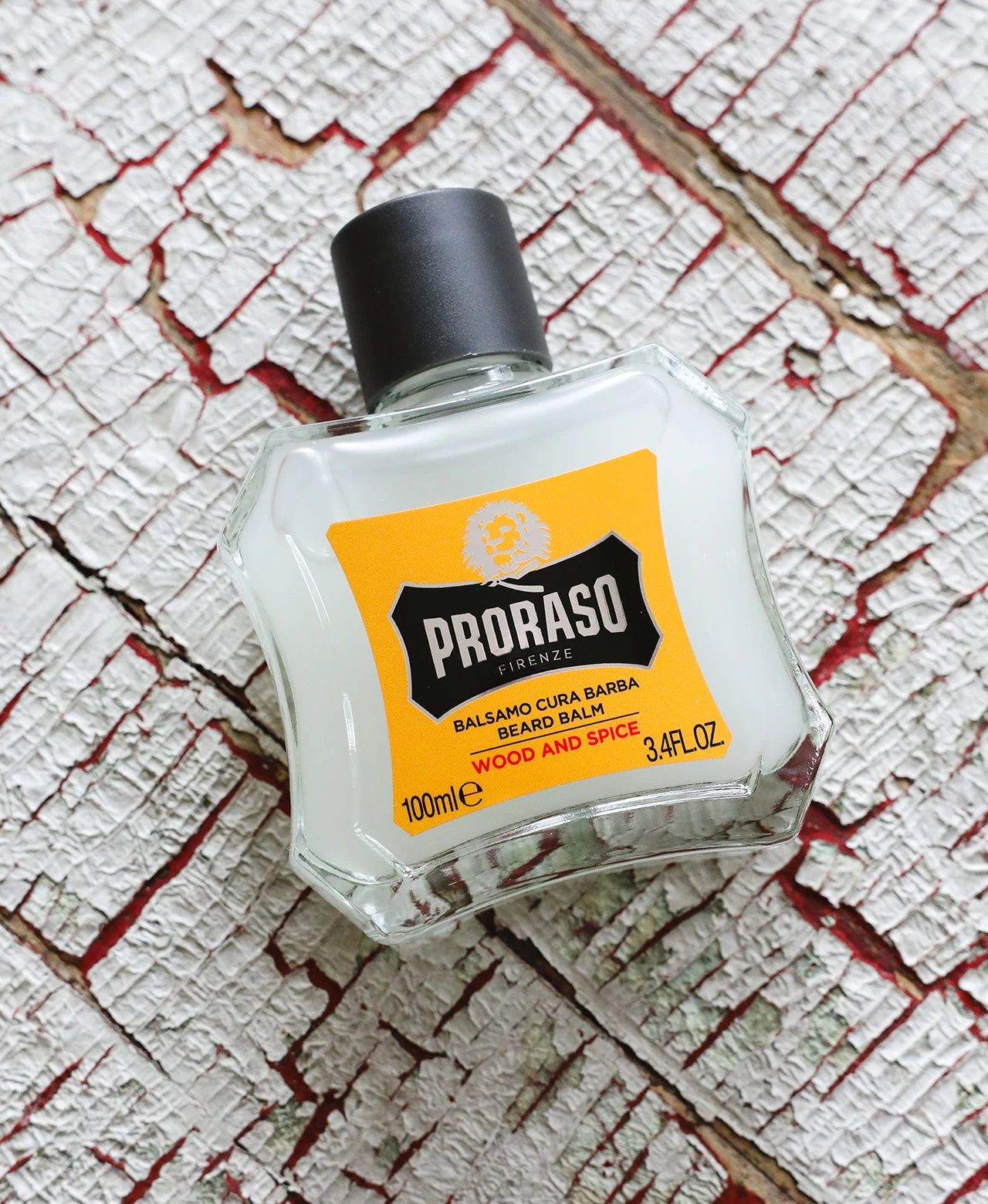 Proraso - Beard Balm - Wood & Spice - 300ml: Wood & Spice Beard Balm Bottle sitting on wooden texture, view 2