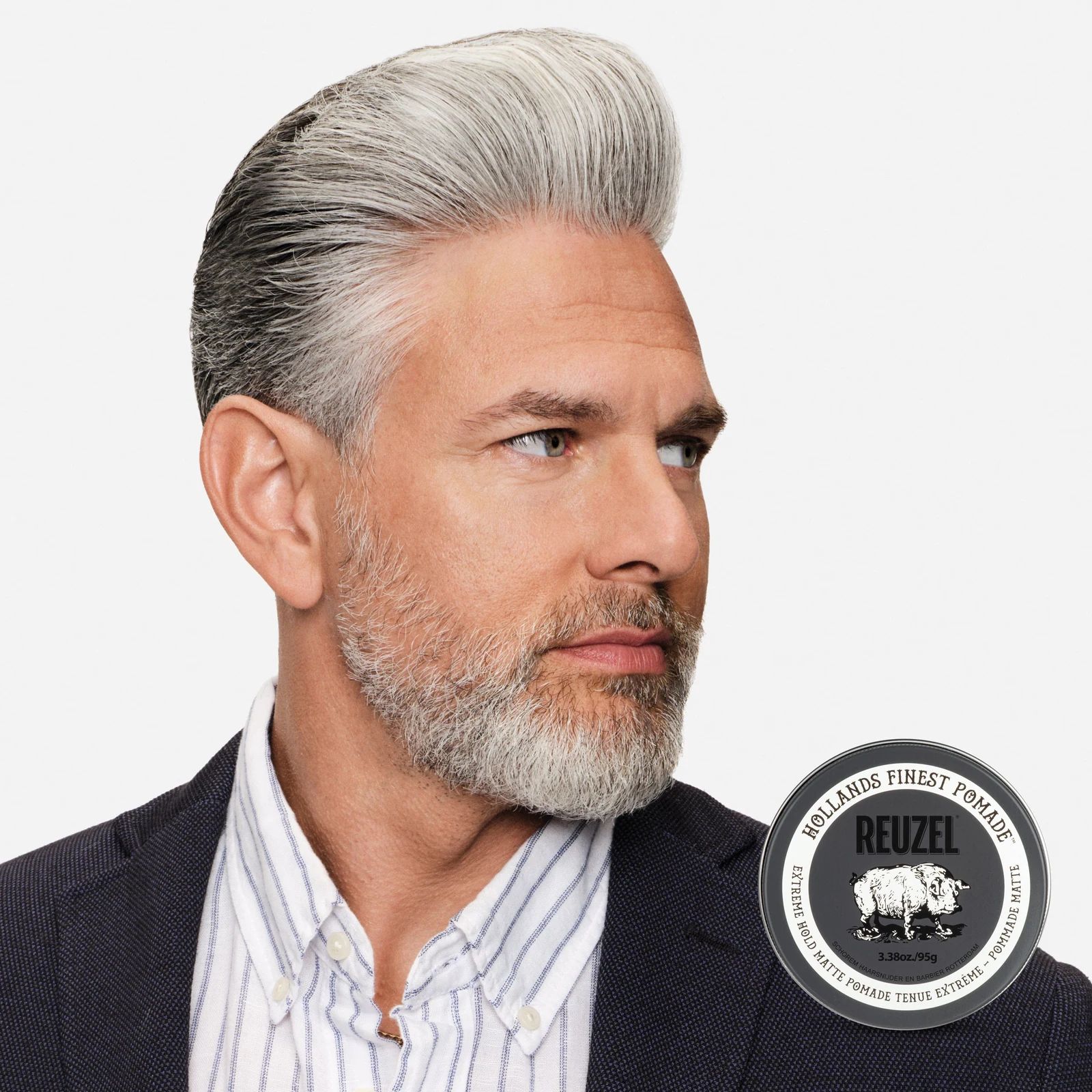 Reuzel Extreme Hold Matte Pomade jar with black label and silver lid, showcasing the product for strong, matte hairstyle hold.