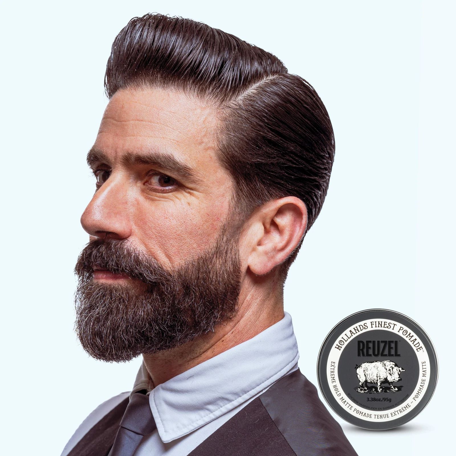 Reuzel extreme hold matte pomade jar with black lid, showing a sleek, matte finish container for strong hold styling., view 6