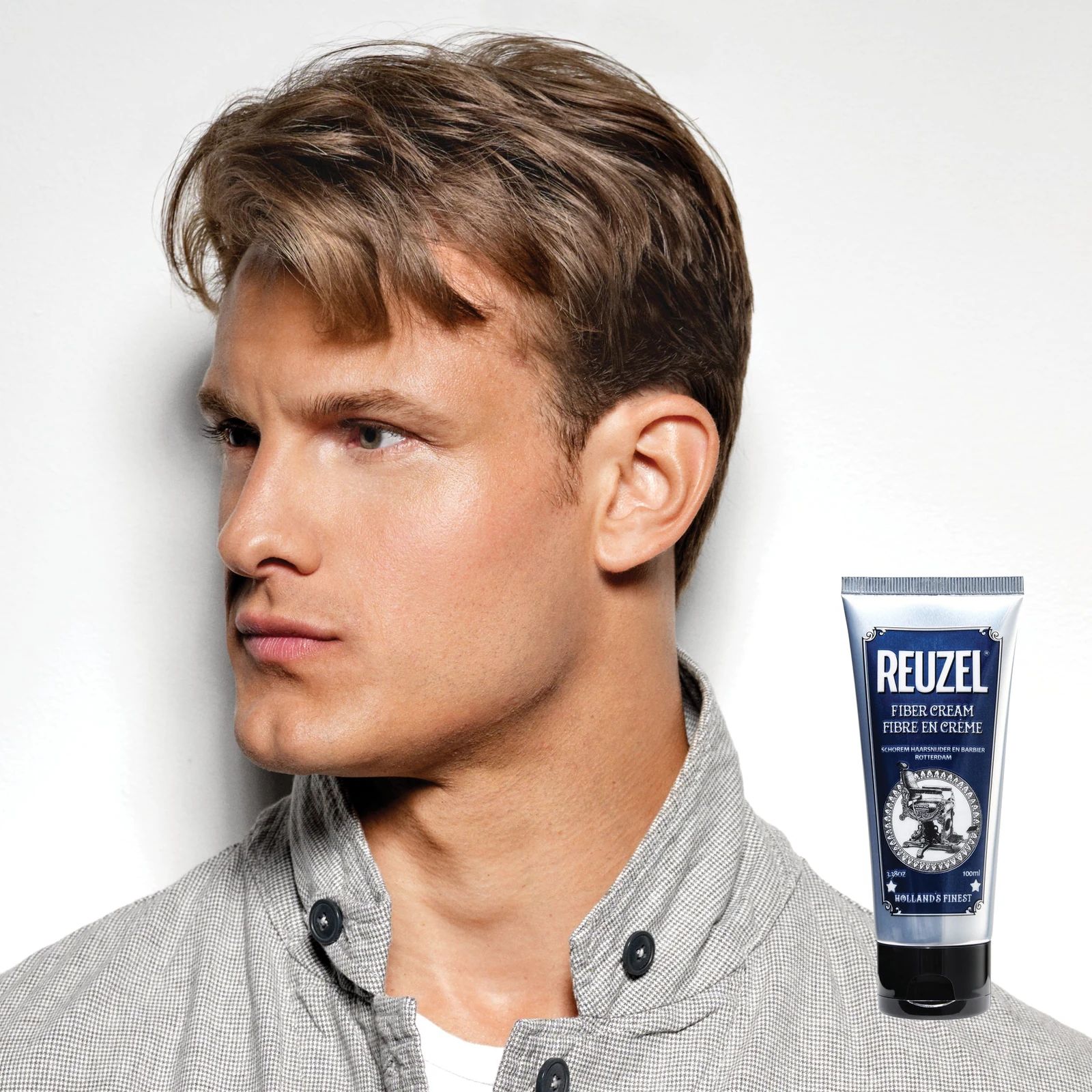 Reuzelinc Fiber Cream in a jar, showing textured cream for styling hair with a thick, matte finish and flexible hold.