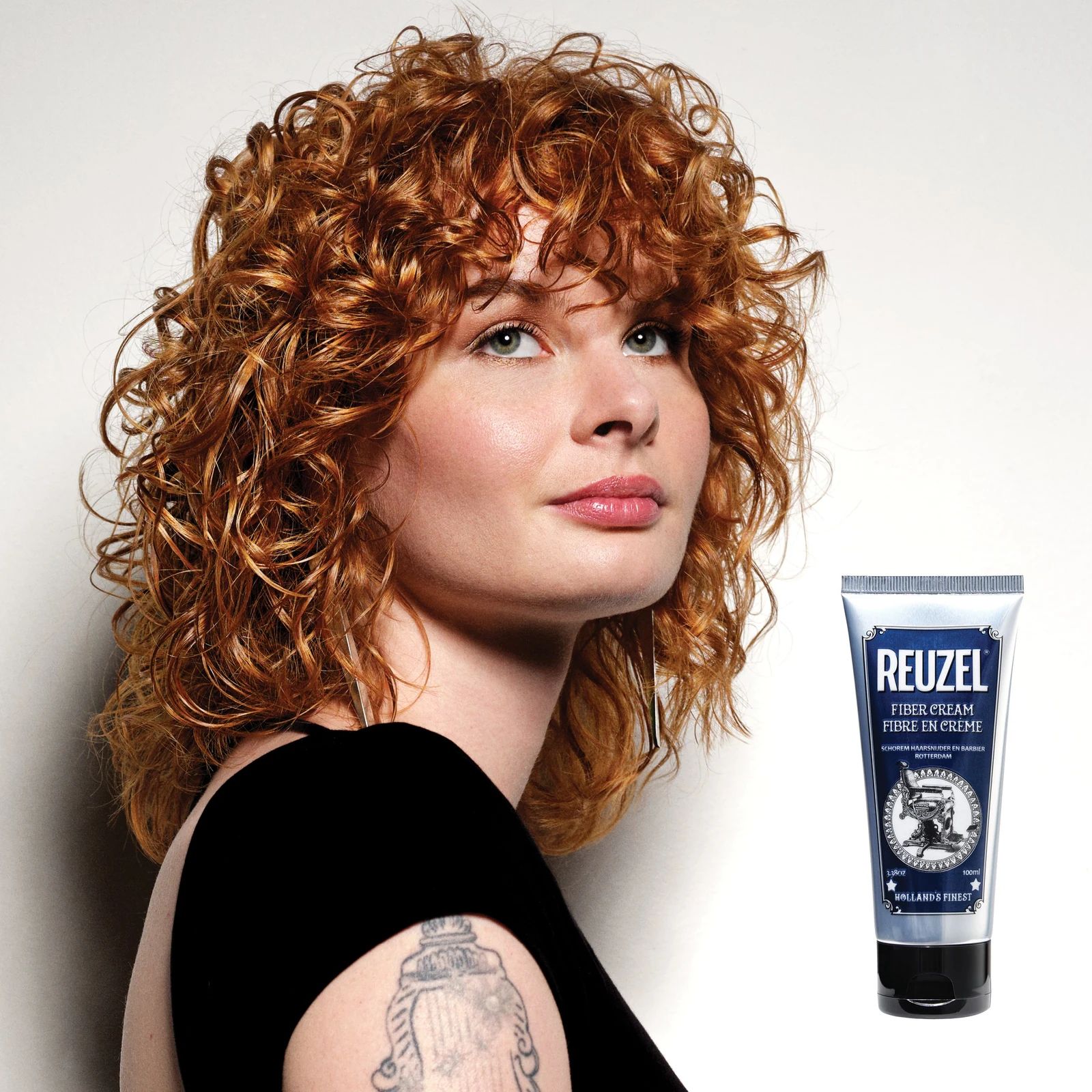 Reuzelinc Fiber Cream in a jar, showing thick hair styling cream with a smooth, creamy texture for textured hairstyles., view 6