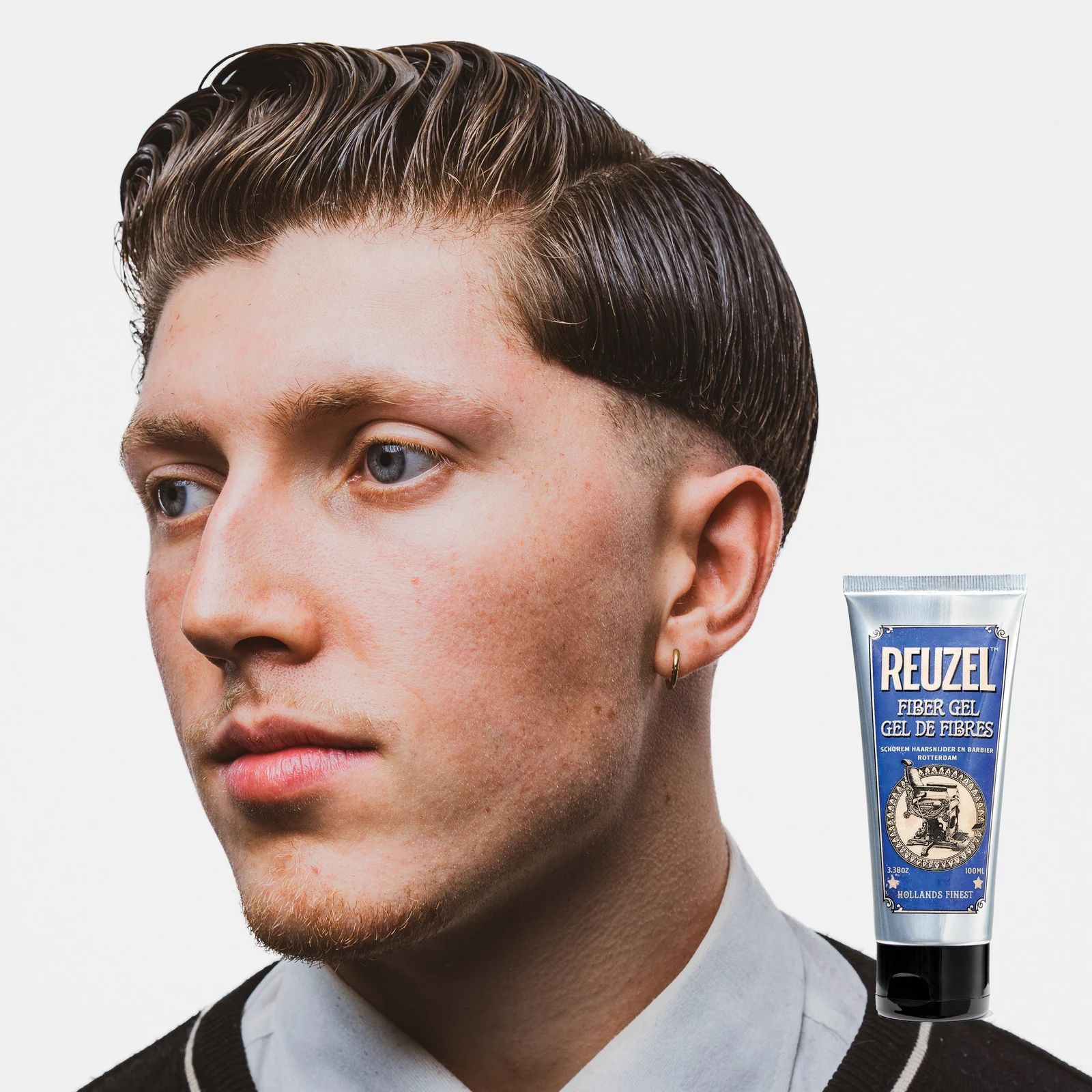Reuzelinc fiber hair gel in a tub, showing thick, textured hair styled with the gel for a strong hold and matte finish.