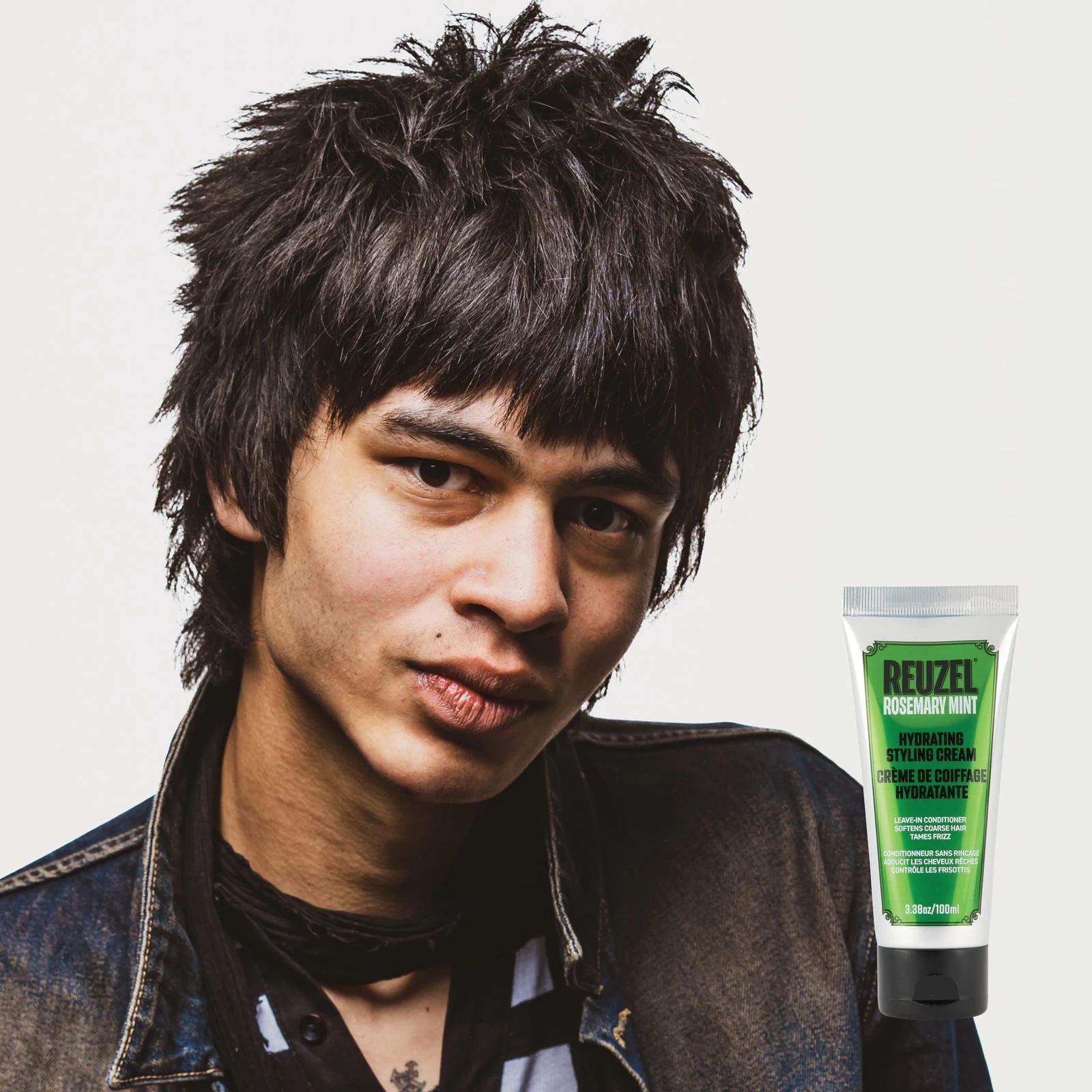 Reuzel - Hydrating Styling Cream: Hydrating styling cream with rosemary and mint by Vendor, showing a jar of the nourishing hair cream with fresh herbs.