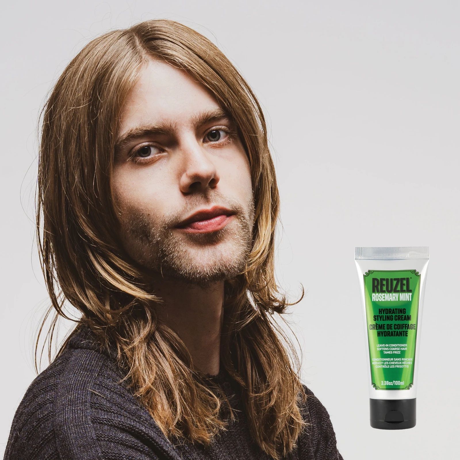 Reuzel - Hydrating Styling Cream: Hydrating styling cream with rosemary and mint by Vendor, showing the cream in a jar with fresh rosemary and mint leaves.