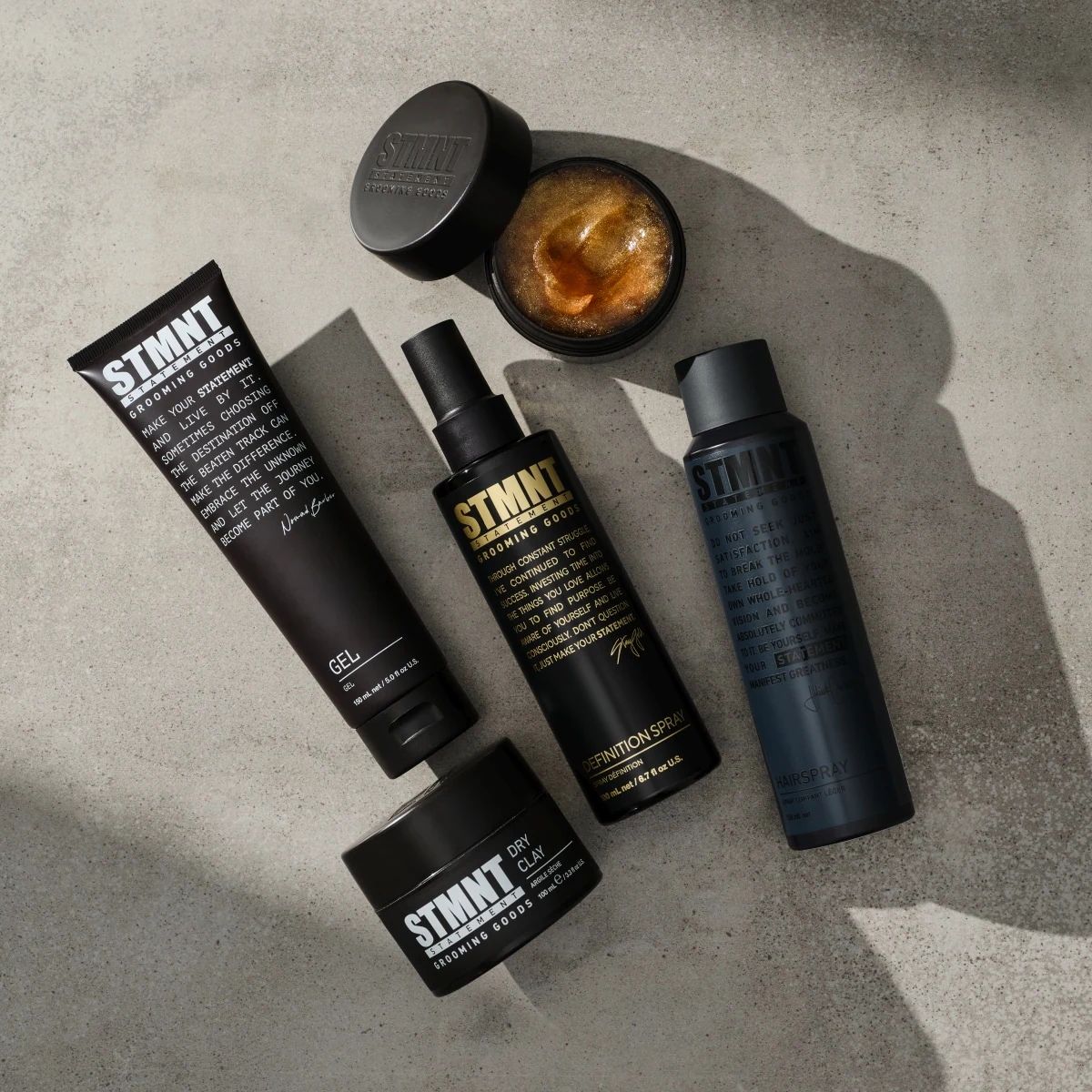 STMNT Hairspray in a professional styling product flat lay