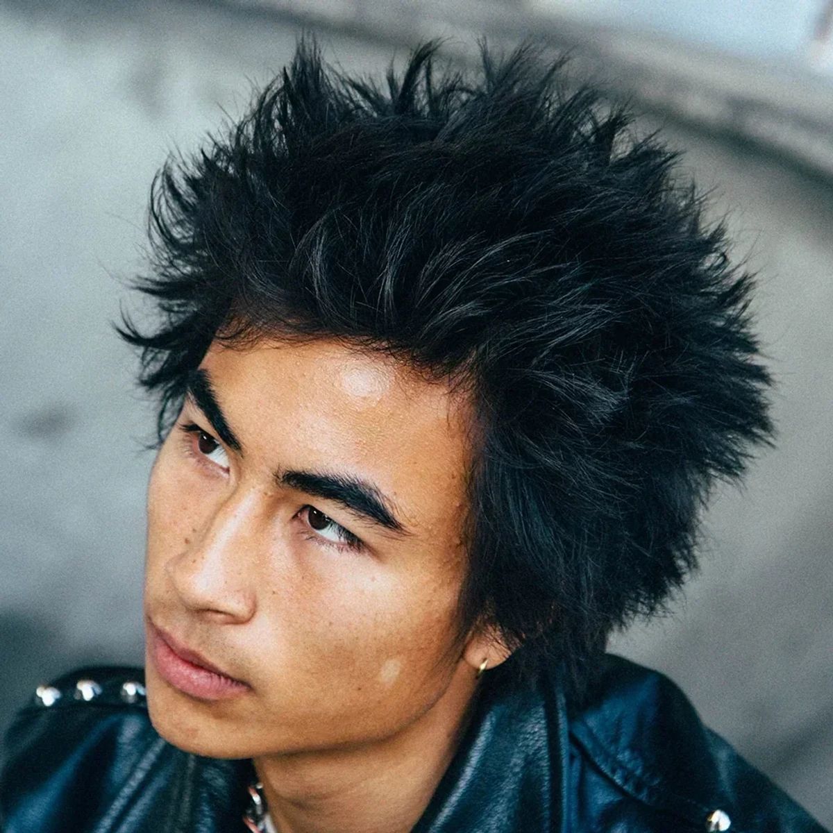 Tall, separated punk point hairstyle created with Skull Dust Styling Powder